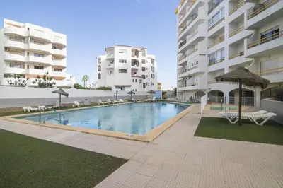 a swimming pool in the middle of a building at Hilcity in Albufeira