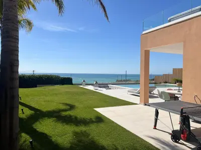 a view of the ocean from the backyard of a house at Villa Oceânica in Albufeira