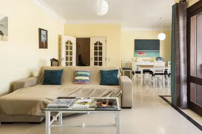 a living room with a couch and a table at Vila Norte - Private Pool by HD PROPERTIES in Vilamoura