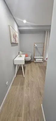 a room with a white table and a bench at Faro Main Avenue Apartment II in Faro