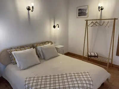 a bedroom with a bed with two pillows at Monte Gerações - Heated pool - Typical Algarvian - close to Quinta Lago, Vale Lobo and Vilamoura in Almancil