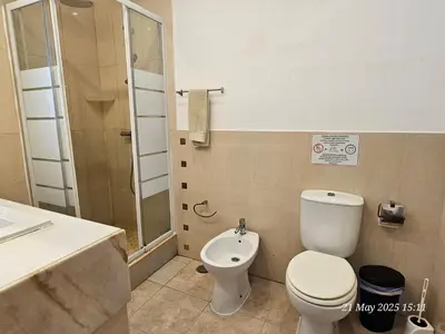 a bathroom with a toilet and a shower and a sink at Blife Ceriya private apartment in Faro