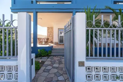 a fence in front of a house at Blife Riamya private apartment in Faro