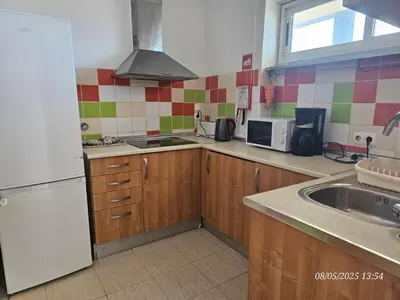 a kitchen with a white refrigerator and a sink at Blife Vistaya private apartment in Faro