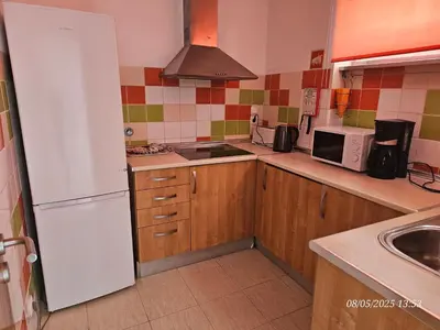 a kitchen with a white refrigerator and a sink at Blife Vistaya private apartment in Faro