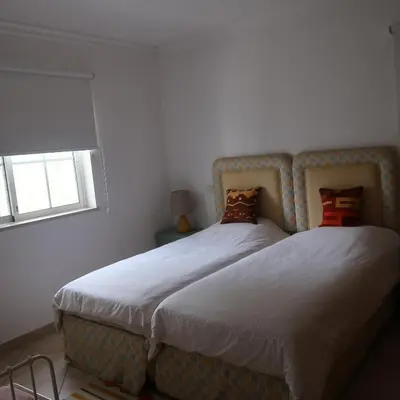 two beds sitting next to each other in a bedroom at Santos Villa in Quinta do Lago in Quinta do Lago