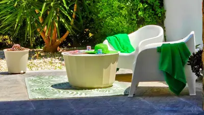 two chairs and a table on a patio at Segolene Design in Albufeira