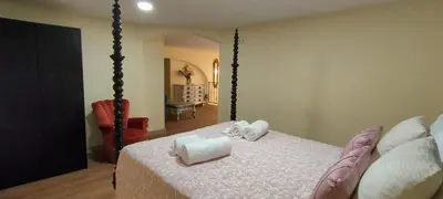 a bedroom with a bed with two towels on it at Grand Studio 52 in Faro