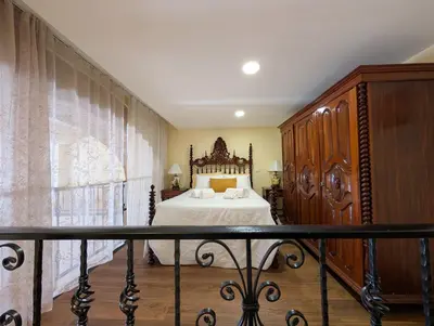 a bedroom with a bed and a large window at Grand Studio 27 in Faro