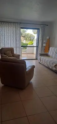 a living room with a couch and a bed at AA Apartamento Solar dos Pinheiros in Vilamoura
