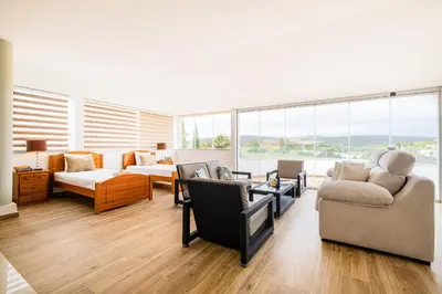 a living room with a couch and a chair at Villa Los Angeles by Algarve Vacation in Boliqueime
