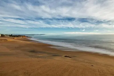 a view of a beach with the ocean at Vacation Apartment in Quarteira in Cavacos