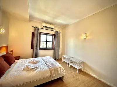 a bedroom with a bed and a window at Vilamoura Central 8 by Homing in Vilamoura