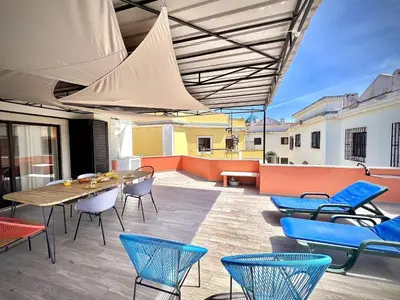 a patio with a table and chairs on a roof at Vilamoura Central 8 by Homing in Vilamoura