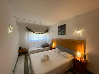 a bedroom with two beds with a teddy bear on it at The Albufeira Concierge - Pool ChoroMar Apartment in Albufeira