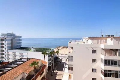 a view of the ocean from a building at Moderno e acolhedor com vista mar in Quarteira