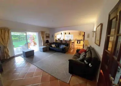 a living room with a couch and a table at Luxury Private 5 bedroom Villa pool, golf, Algarve in Quarteira