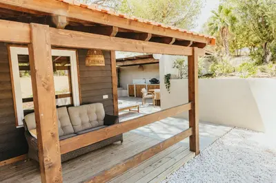 a porch of a house with a patio at Casa Ana Almancil in Almancil