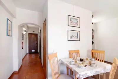 a dining room with a table and chairs at Apartarment Azur in Albufeira