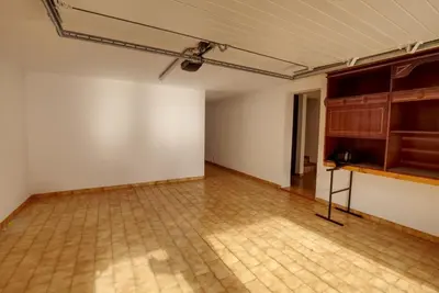 an empty room with a tile floor and a ceiling at Townhouse in Quarteira in Quarteira