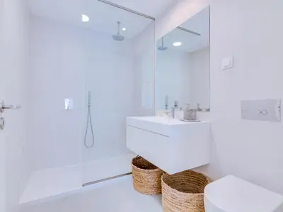 a white bathroom with a sink and a mirror at AL - Villas Country Club in Vilamoura