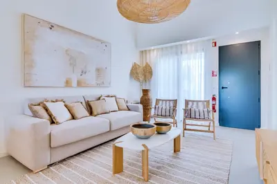 a living room with a couch and a table at AL - Villas Country Club in Vilamoura
