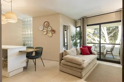 a living room with a couch and a table at Dona Marieta House in Vilamoura