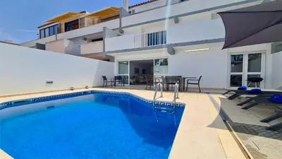 a swimming pool in the backyard of a house at Marina parque CD 68 - Cleverdetails - private pool, few steps to the marina in Vilamoura