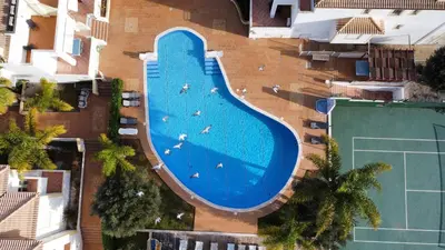 an overhead view of a large swimming pool at Daisy 2 Bedroom Apartment in Albufeira