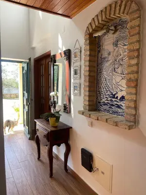 a room with a table and a painting on the wall at AL Monte Lusitano in Loulé