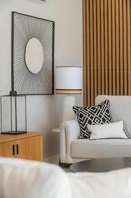 a living room with a white couch and a lamp at Valbom Luxury Village in Galé