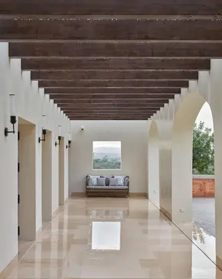 a room with rows of chairs and a flat screen tv at Viceroy at Ombria Algarve in Loulé