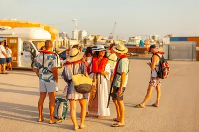a group of people standing in front of a bus at Apartment Santa Monica by Algarve Vacation in Albufeira