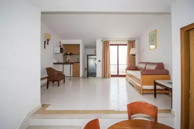 a living room with a couch and a table at Brilliant Apartments 1 Beedroom in Quarteira