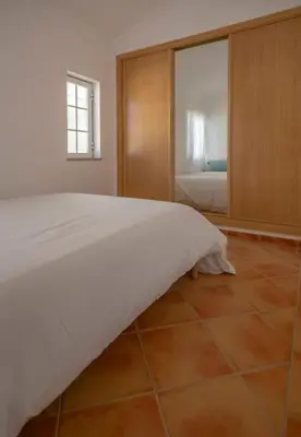 a room with a green door and a window at Summer Villa in Albufeira