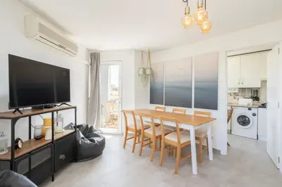 a kitchen and dining room with a table and chairs at TAC - Bliss Vilamoura in Quarteira
