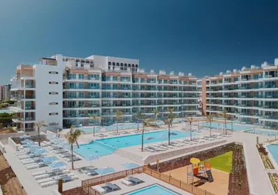 a large apartment complex with a large swimming pool at Dom Pedro Residences in Vilamoura