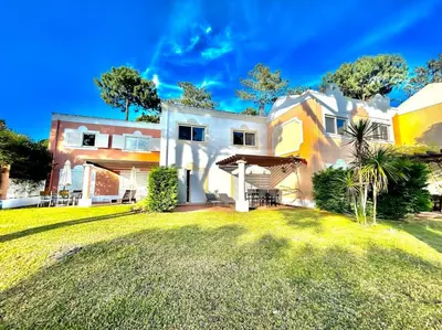 a large white house with a large yard at Heart of Quinta do Lago ! in Faro