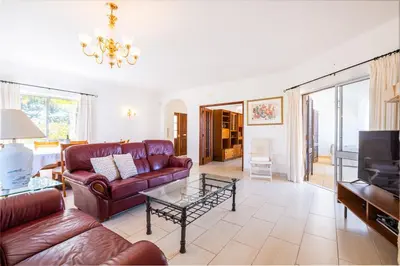 a living room with a couch and a coffee table at Villa Brid in Albufeira