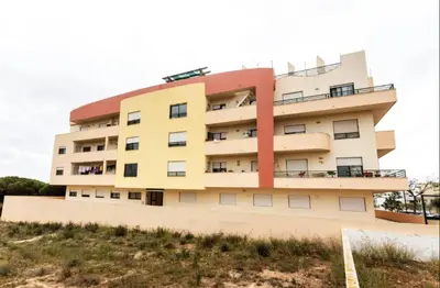 a building on top of a hill at Blife RYA private rooms - Airport stay in Faro