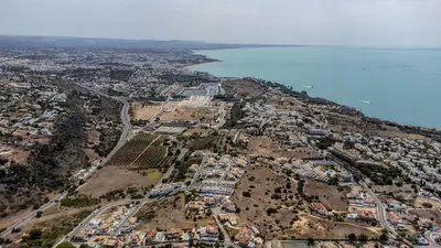 an aerial view of a town on a hill next to the water at Villa Feliz Algarve with Private Pool - São Rafael in Albufeira