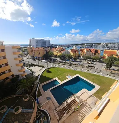 a view of a swimming pool in a city at MILA - Vilamoura in Vilamoura