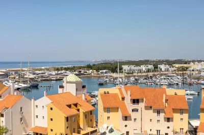 a view of a harbor with houses and boats at MILA - Vilamoura in Vilamoura