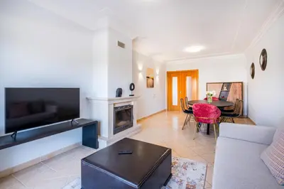 a living room with a couch and a table at Farmvillage Apartment - Free Wifi in Albufeira