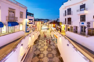 a view of a city street at night at Casa Merrigan in Albufeira
