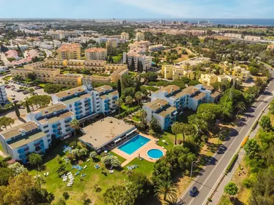 an aerial view of a city with buildings at 1BR Apartment with Pool @ Lago Azul in Quarteira