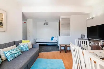 an apartment with a swimming pool and a building at 1BR Apartment with Pool @ Lago Azul in Quarteira