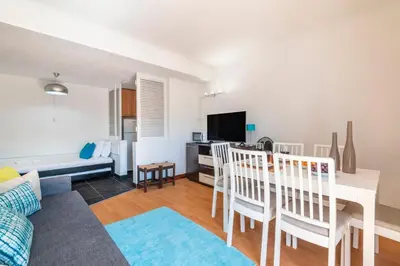 an open living room and kitchen with a fire extinguisher at 1BR Apartment with Pool @ Lago Azul in Quarteira