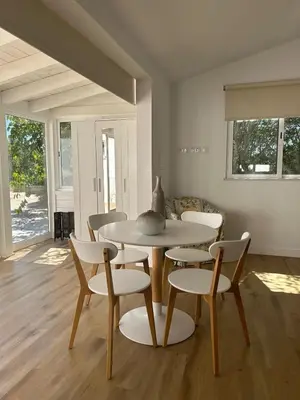 a dining room with a table and chairs at Quinta Verde Algarve in Medronhal