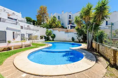 a swimming pool in the backyard of a house at Albufeira - Sun, Pool and Marina View! in Albufeira